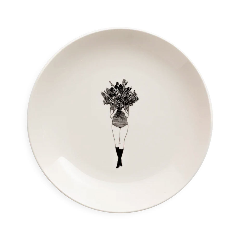 Helen B white plate with a line drawing of a girl holding a bunch of flowers