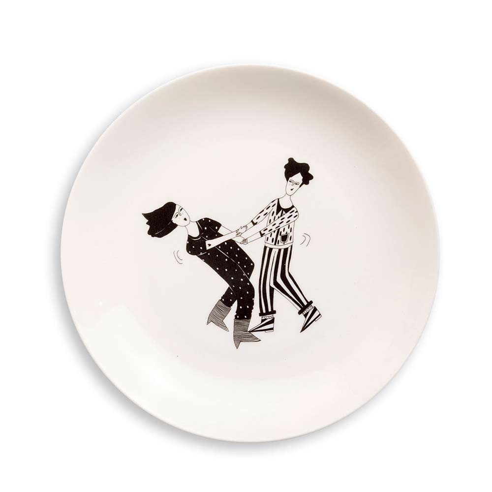 White plate with a black line drawing of a couple dancing