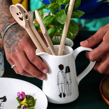 Helen B naked couple jug holding wooden spoons