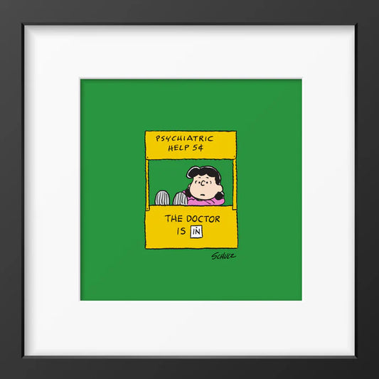 Peanuts framed print: Lucy in her 'Psychiatric help 5¢' booth on green, in a black frame