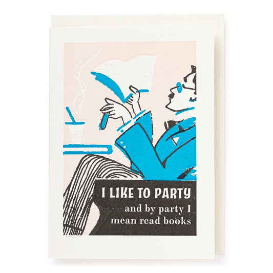 Card of a man reading in an armchair: I like to party, and by party I mean read books