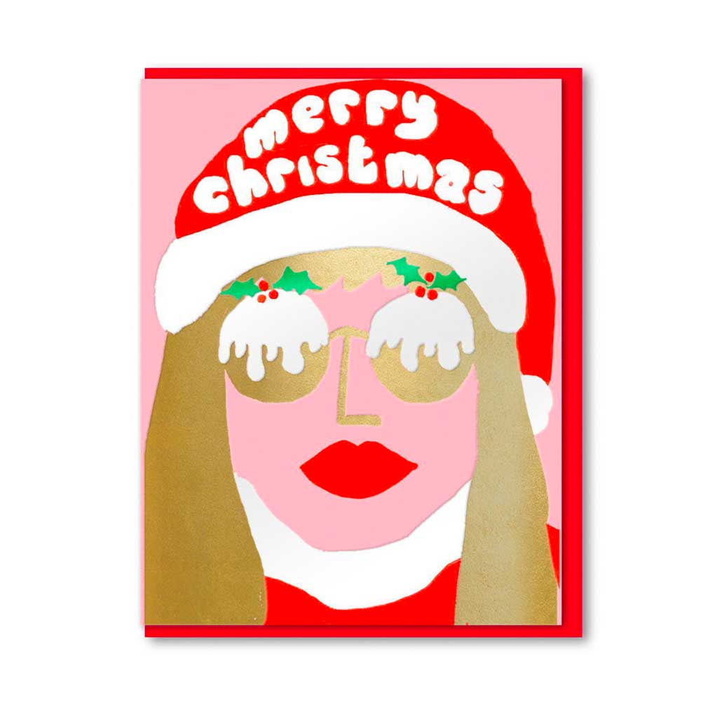 1973 Christmas card: a woman in a Santa hat and Christmas pudding sunglasses, with 'Merry Christmas'