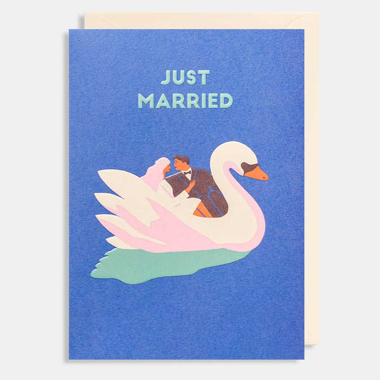 Lagom card: a couple riding a white swan boat on blue, with 'Just married'
