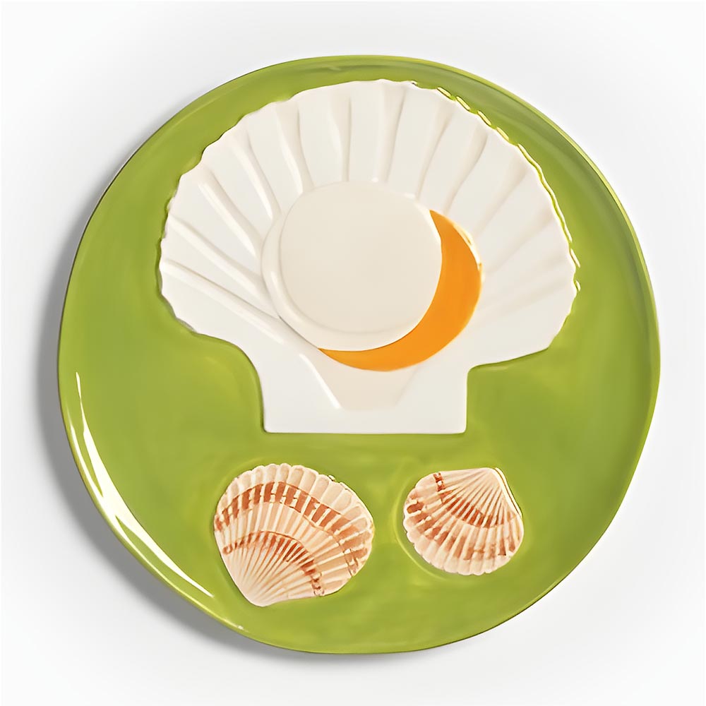 Close-up of the green scallop shell plate