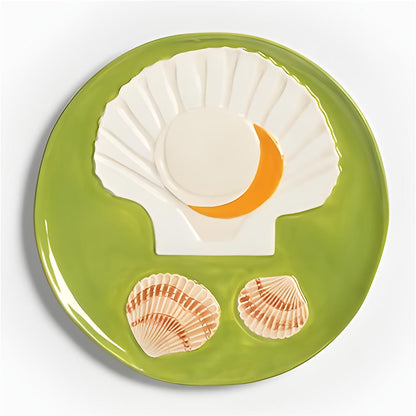 Close-up of the green scallop shell plate