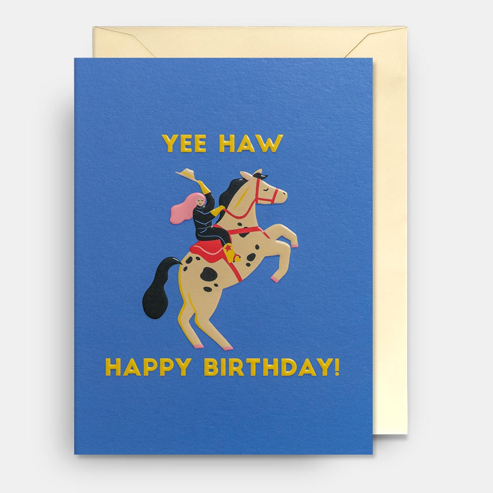 Lagom mini card: a cowgirl on a rearing horse, with gold 'Yee haw – Happy birthday!' on blue