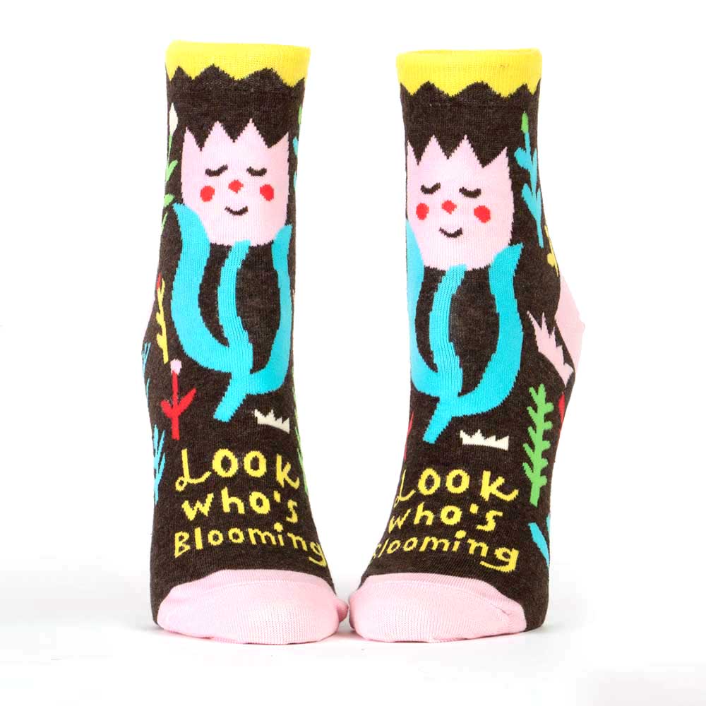 Brown ankle socks with a smiling flower woman and bright leaves: Look who's blooming