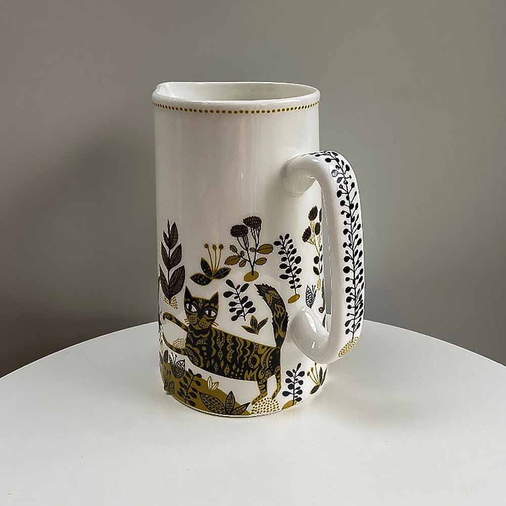 Yellow cat jug from the side