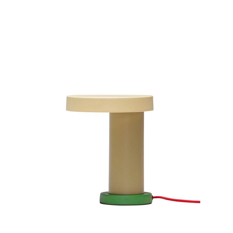 Table lamp with a cream round shade on an olive base and a red cable