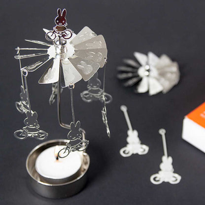 Miffy angel chime pieces beside a tealight