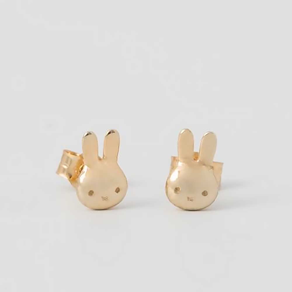 Close-up of the gold Miffy stud earrings
