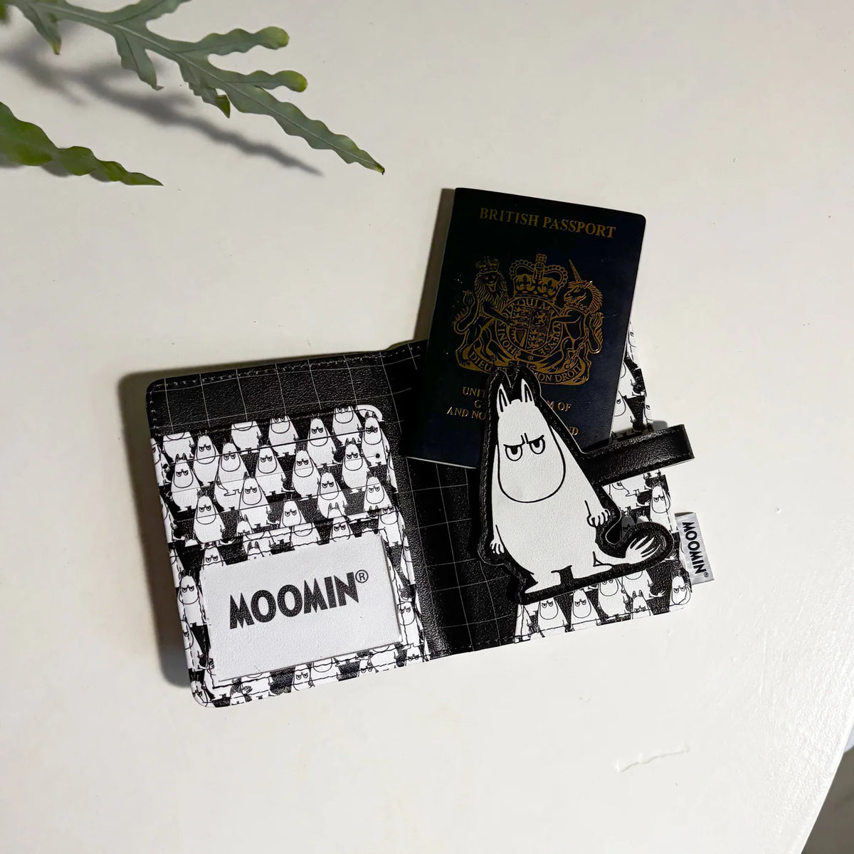 Passport tucked into the Angry Moomin passport holder