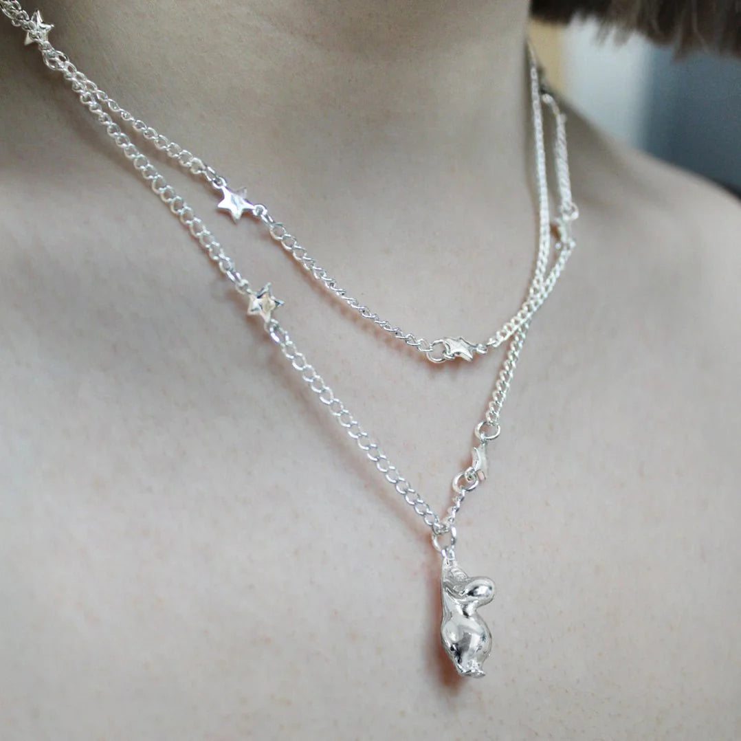 Silver Moomin necklace with a Moomintroll pendant and stars