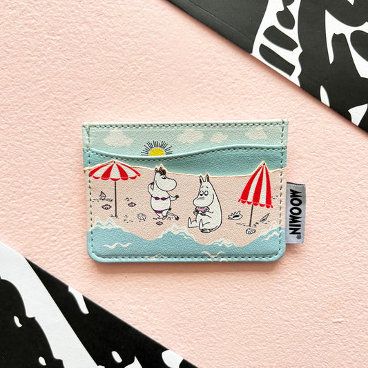 Moomin card holder printed with Moomins on a beach under red and white parasols