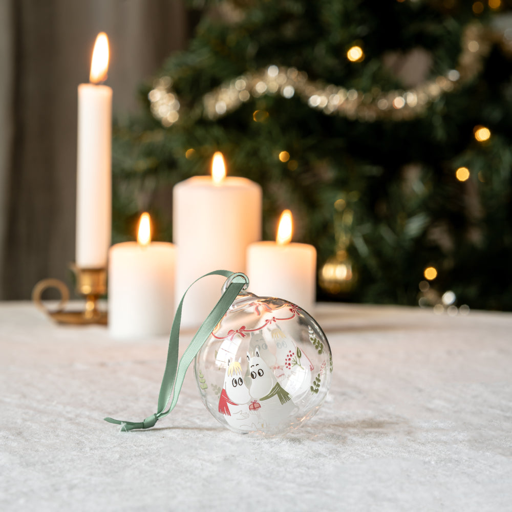 My Darling bauble on a table with candles and a Christmas tree