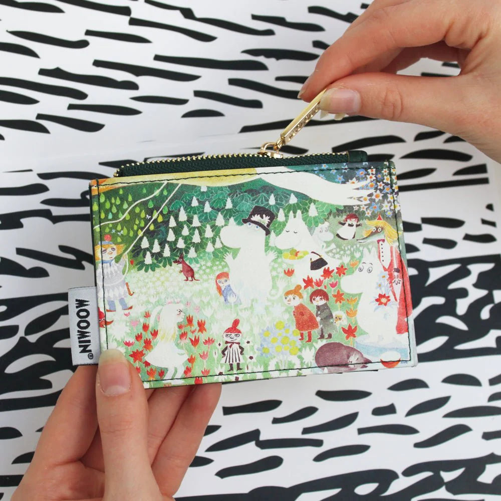 Hand opening the Dangerous Journey coin purse