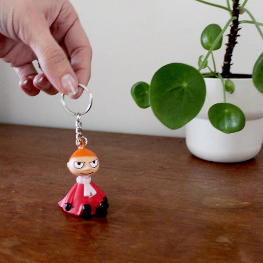 Hand holding the Little My light-up key ring