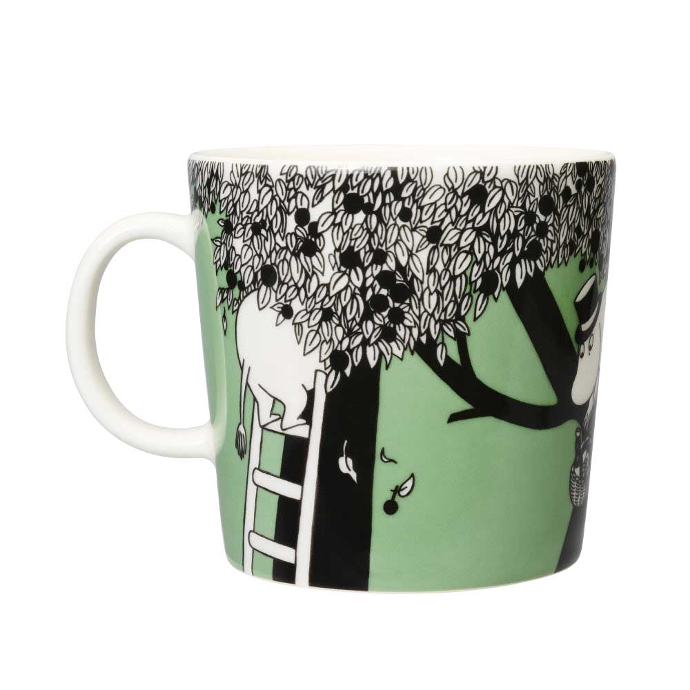 Other side of the green Moomin mug with a ladder up the tree