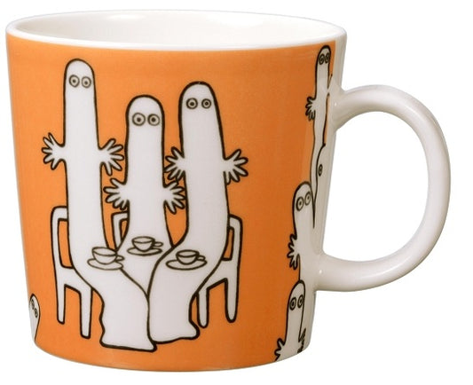 Moomin Hattifatteners mug: white Hattifatteners standing around a table on orange