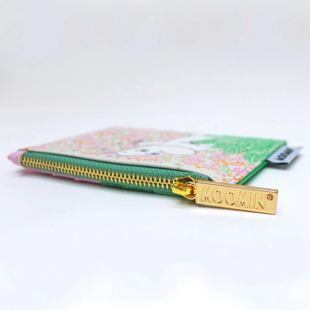 Close-up of the gold Moomin zip pull on the ditsy purse