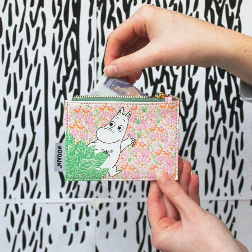 Hands opening the Moomin ditsy coin purse