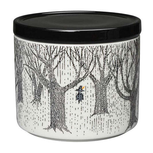 Moomin storage jar with a black lid: Moomintroll walking through a black and white winter forest