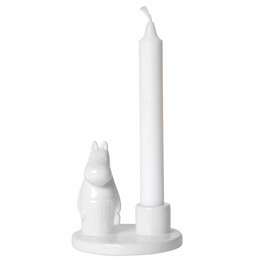 White porcelain candle holder with Moominmamma beside a white candle