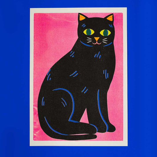 Naomi Wilkinson A3 riso print: a black cat sitting on pink