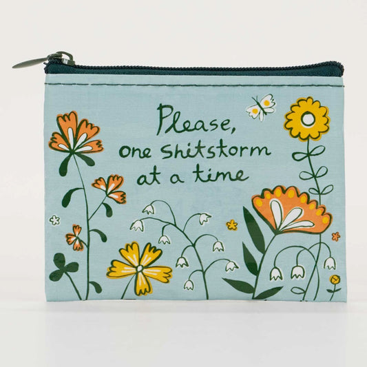 Blue Q coin purse: orange and yellow flowers with 'Please, one shitstorm at a time'