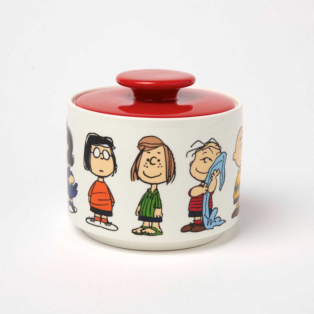 Peanuts candy jar with a red lid, printed with the Peanuts gang