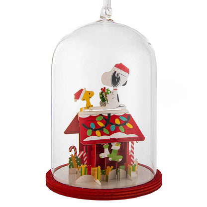 Glass dome decoration showing Snoopy and Woodstock with Christmas lights