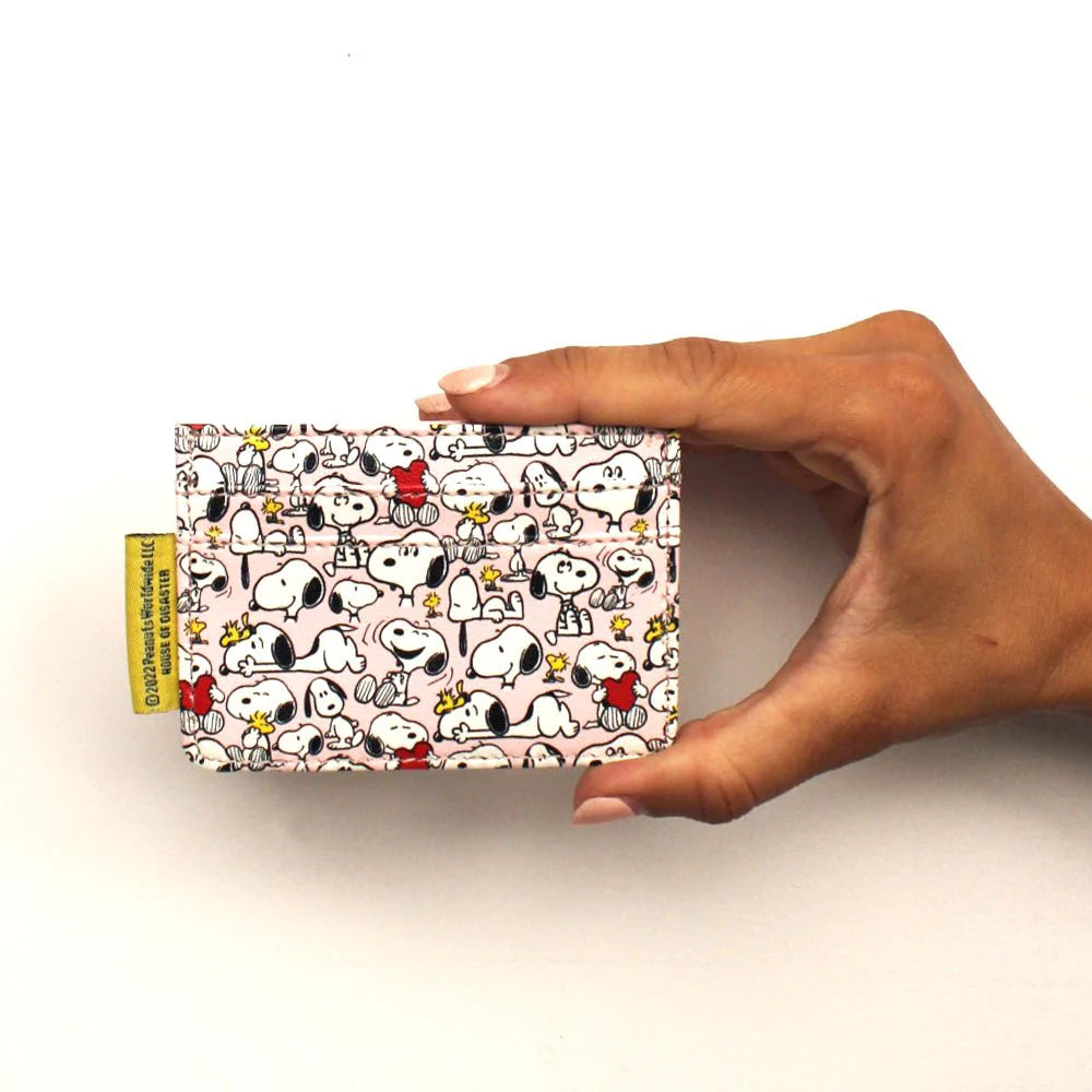 Back of the pink Peanuts card holder: an all-over pattern of Snoopy and Woodstock with red hearts