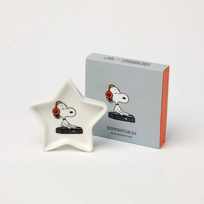 White star-shaped trinket dish with Snoopy as a DJ in headphones, beside its box