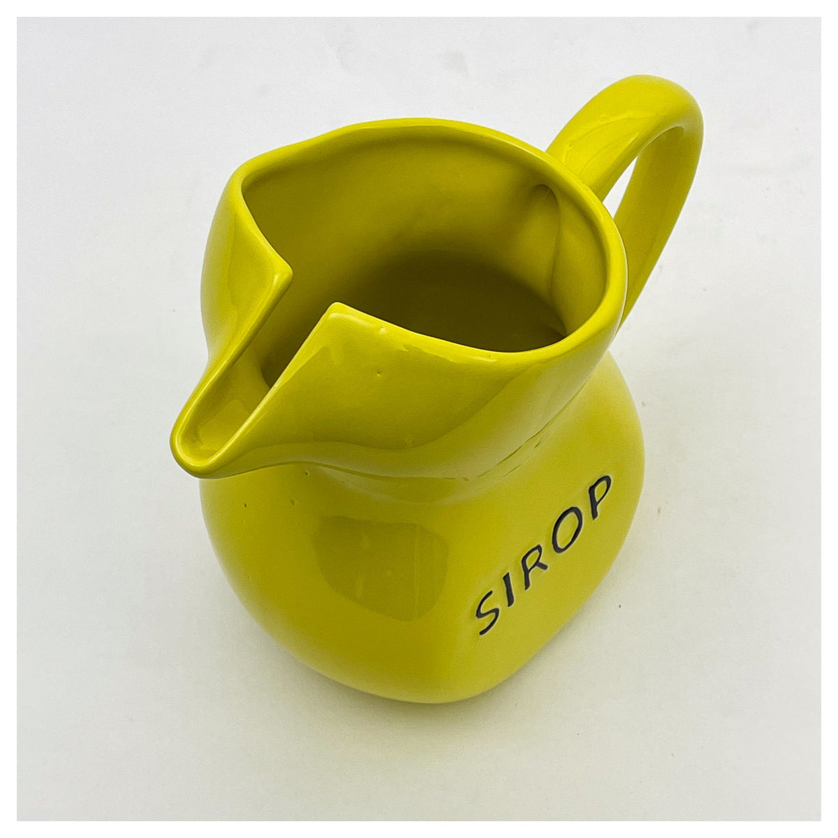 Yellow Sirop jug from above, showing its pinched spout