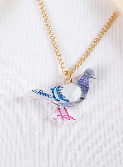 Pigeon pendant worn with a white jumper
