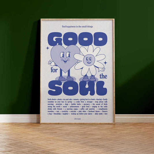 Blue A3 print with a smiling heart and flower: Good for the soul, in a frame against a green wall