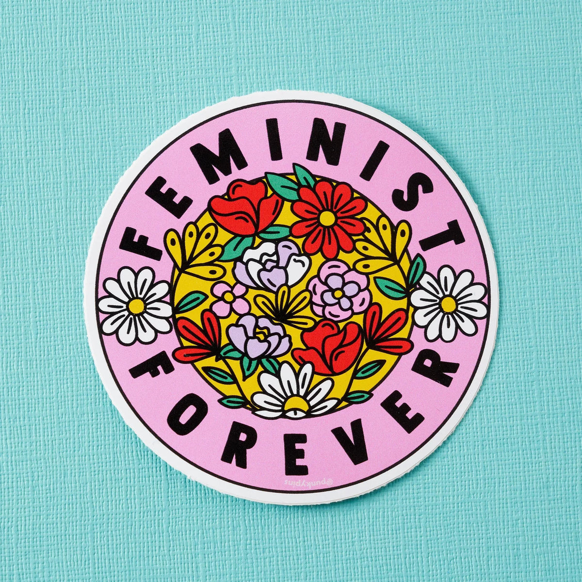 Round pink sticker with a bunch of flowers: Feminist forever