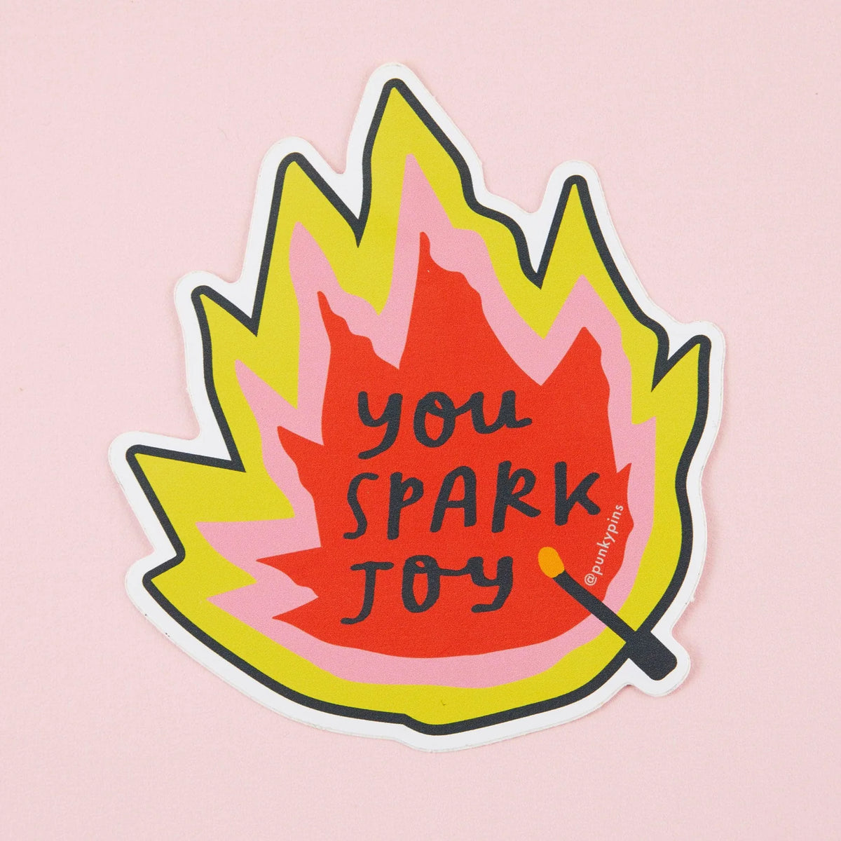 Flame-shaped sticker with a match: You spark joy