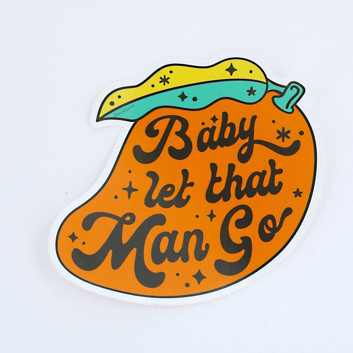 Punky Pins mango-shaped sticker reading 'Baby let that man go'