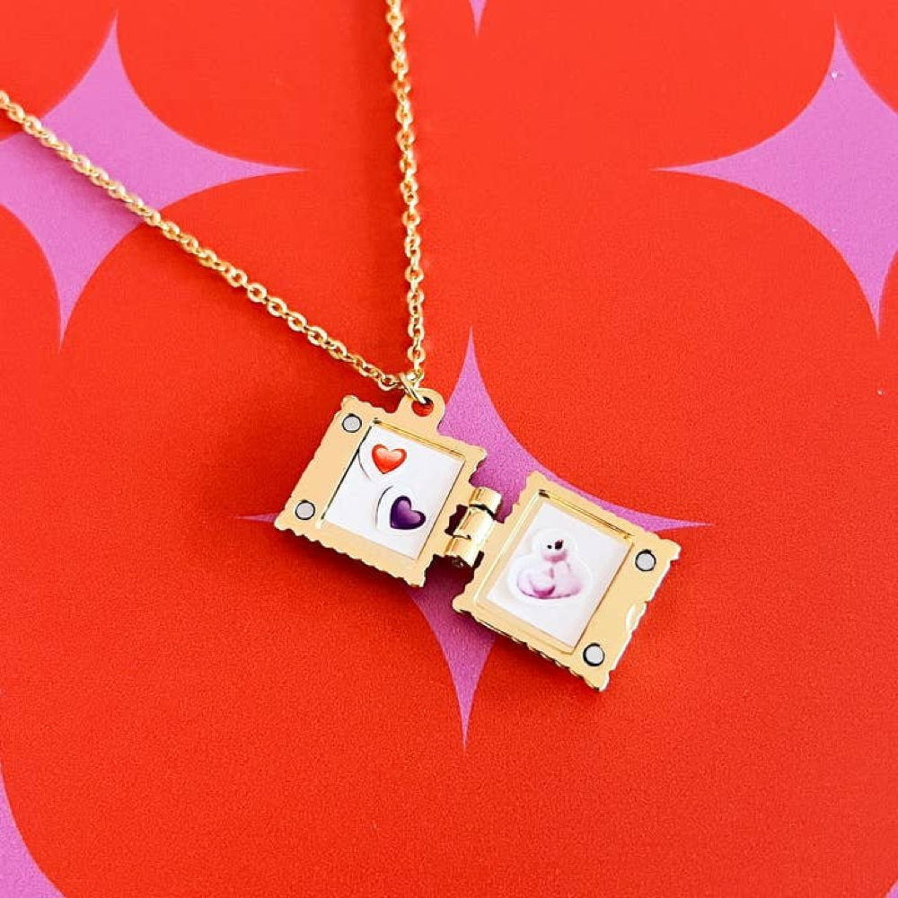 Ravioli locket open to show two tiny pictures