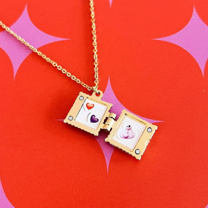 Ravioli locket open to show two tiny pictures