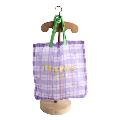 Thanks organza bag hanging on a wooden stand