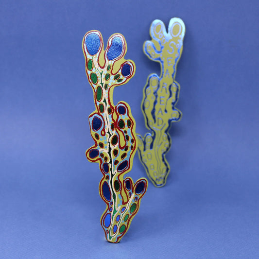 Pair of leather seaweed bookmarks in green and yellow on a blue background