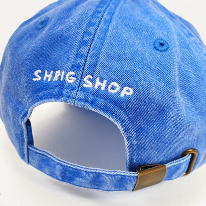 Back of the cap with 'Shrig Shop' embroidered