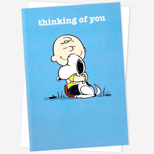 Peanuts card: Charlie Brown hugging Snoopy on blue, with 'Thinking of you'