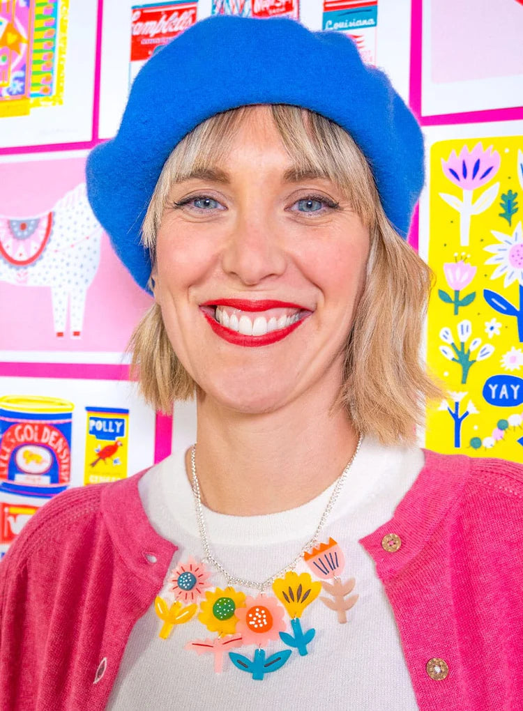 Woman in a blue beret wearing the springtime flowers necklace