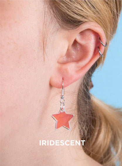 Iridescent star earring worn