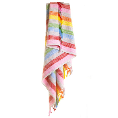 Rainbow grey stripe throw hanging over a rail