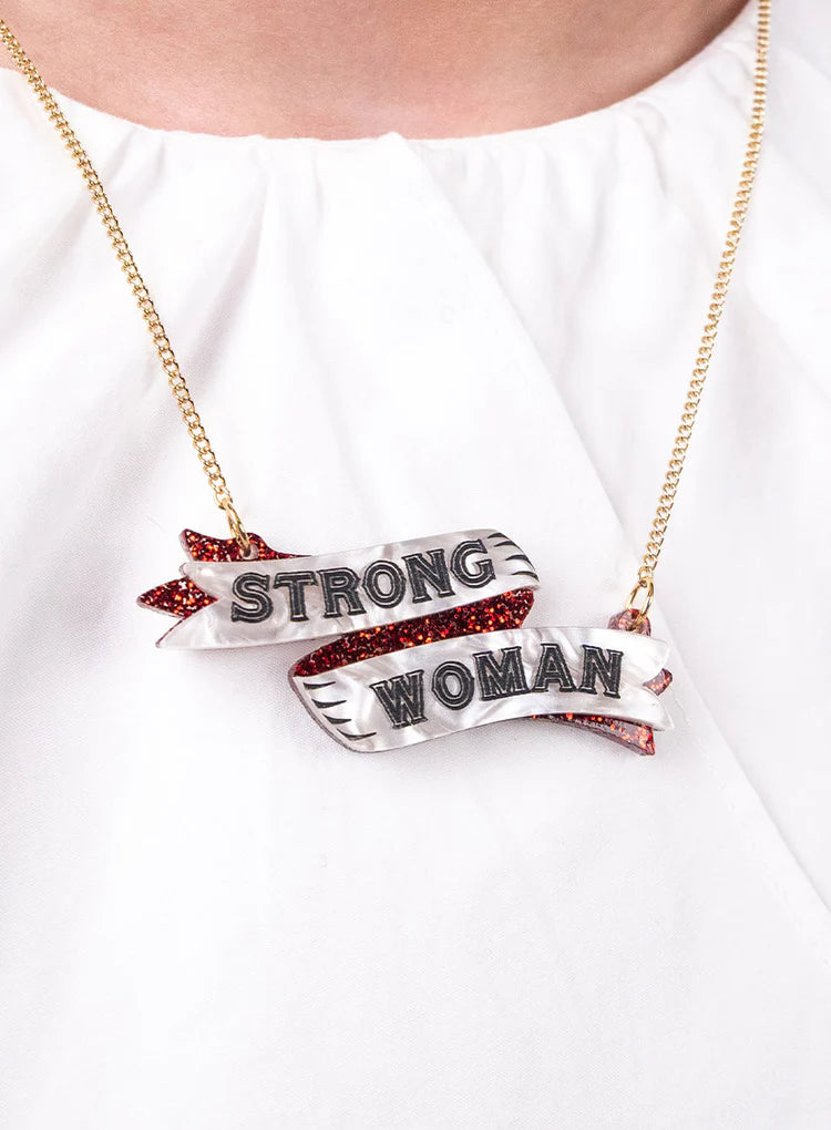 Strong Woman necklace worn with a white top