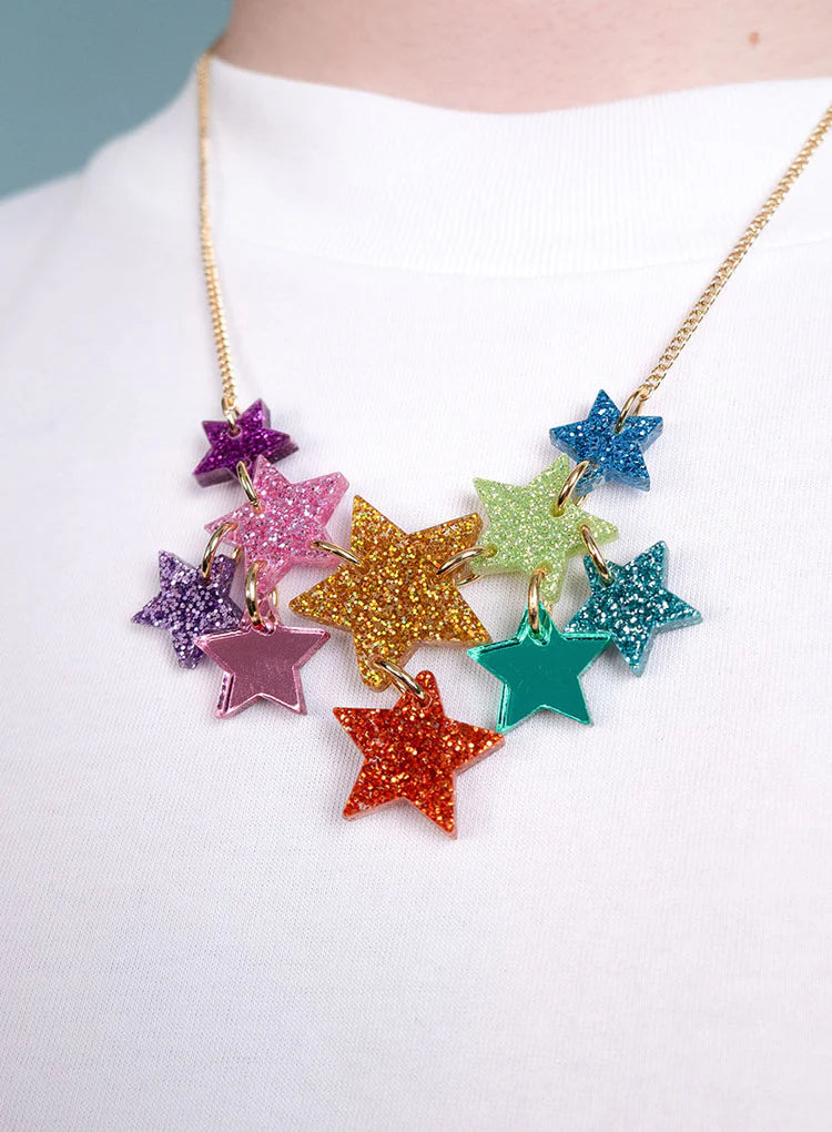 Super Star necklace worn with a white top
